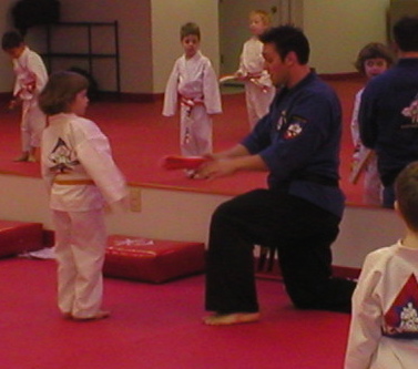 Eli gets her orange belt.JPG