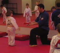 Eli gets her orange belt.JPG
